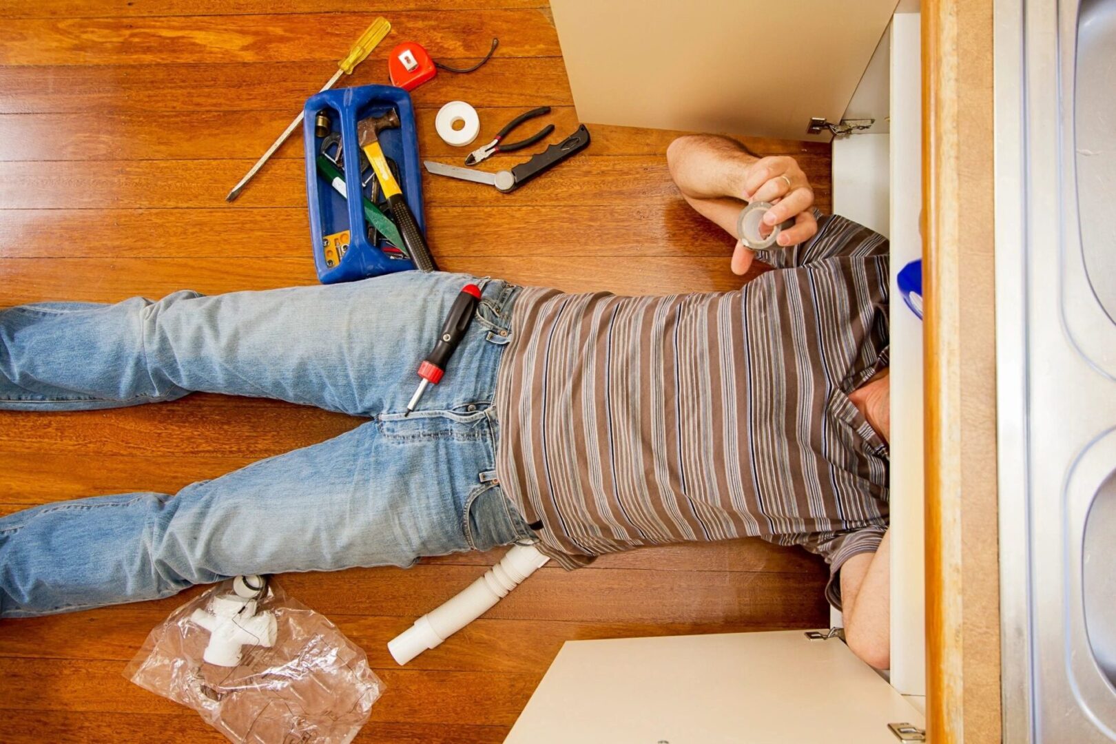 plumber under sink