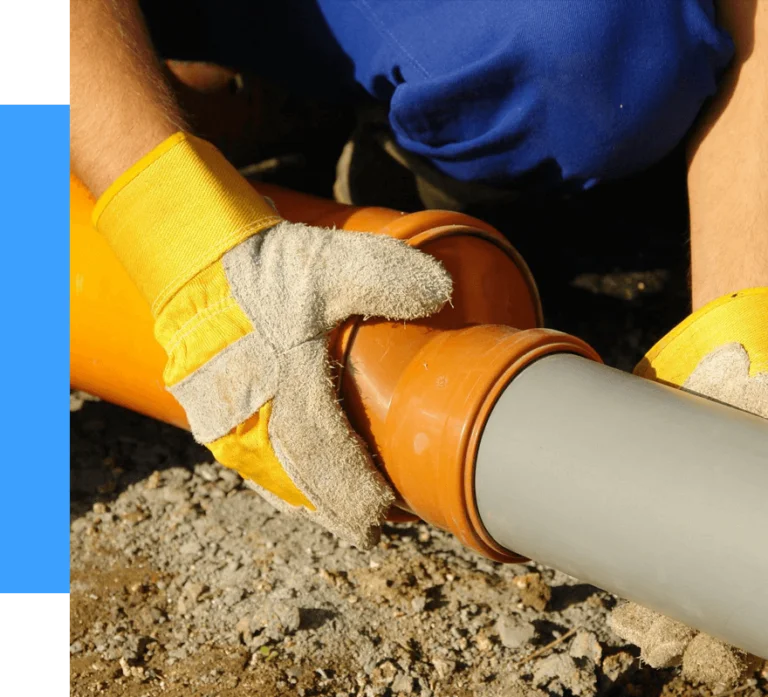 plumber fixing drain pipe