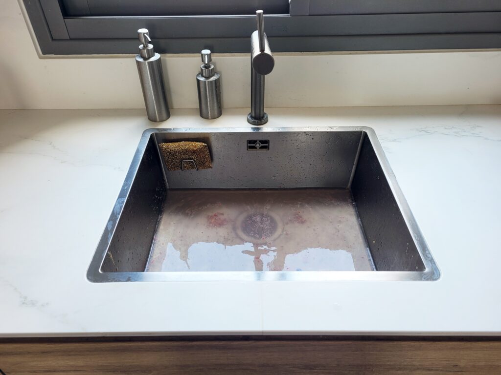 Backed-up drain in a Pigeon Forge home needing emergency drain cleaning