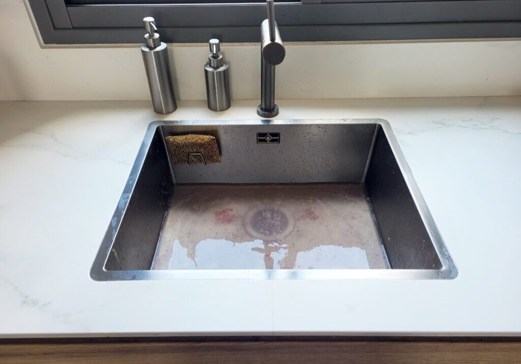 Backed-up drain in a Pigeon Forge home needing emergency drain cleaning