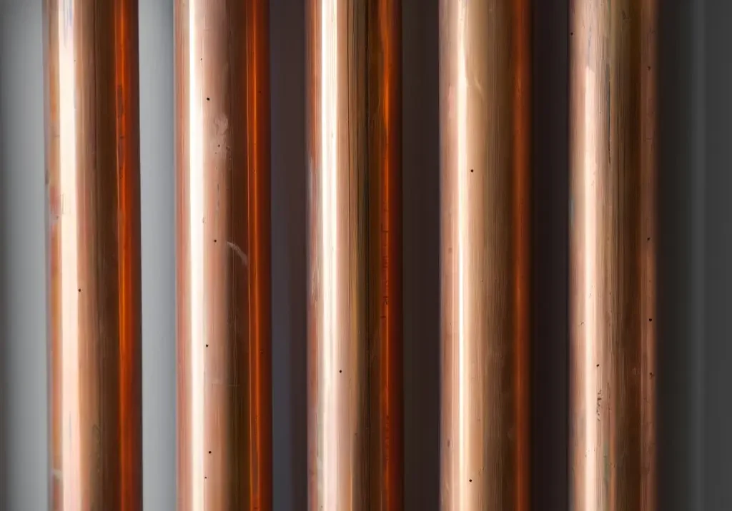 Copper pipes illustrating water hammering causes and prevention to avoid pipe damage.